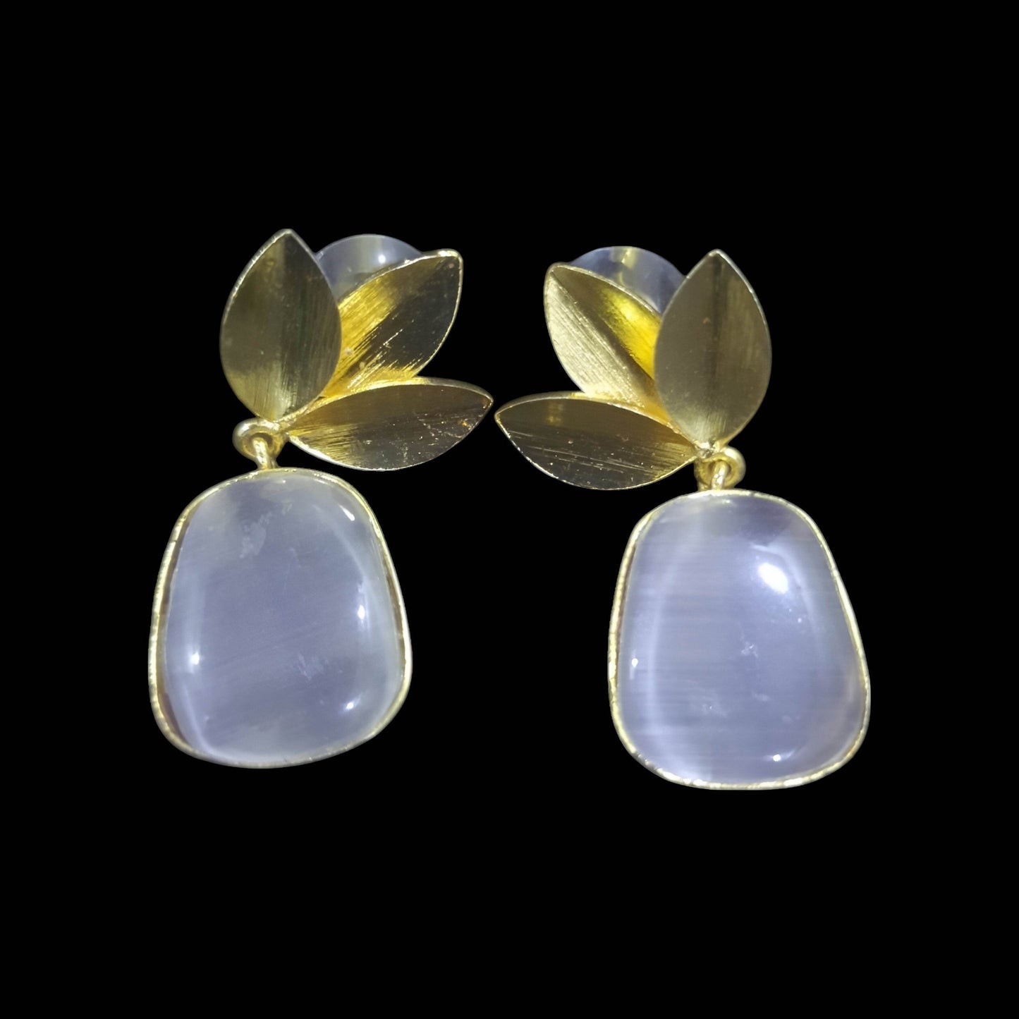 Elegant amber stone leaf design earrings with gold accents and a modern aesthetic