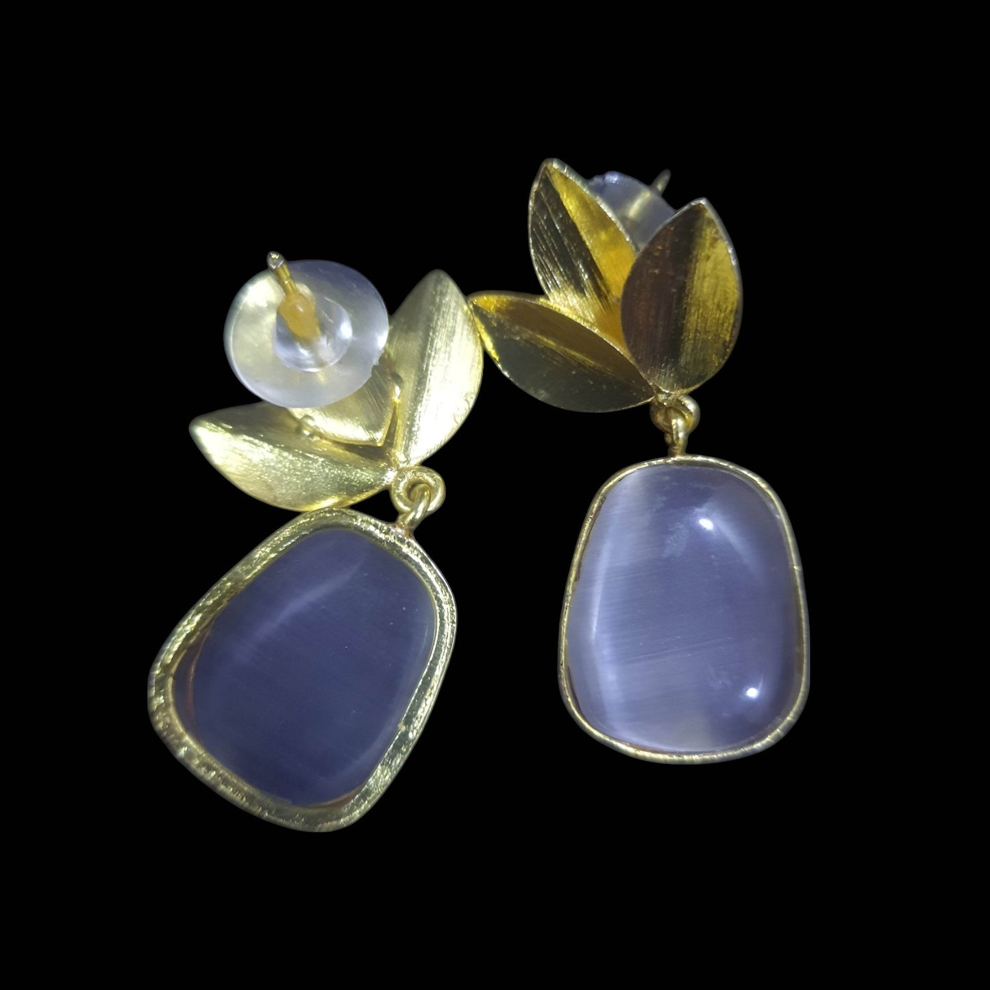 Elegant amber stone leaf design earrings featuring gold-tone accents and unique shapes