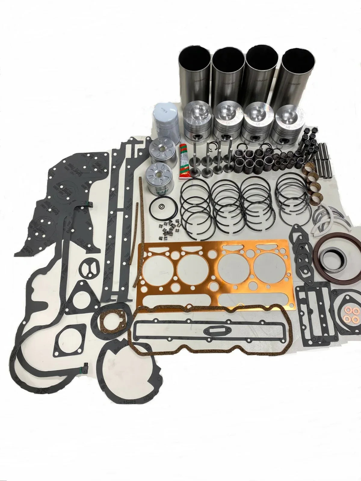 Engine overhaul rebuild kit with gaskets, pistons, cylinders, and rings for tractor engines