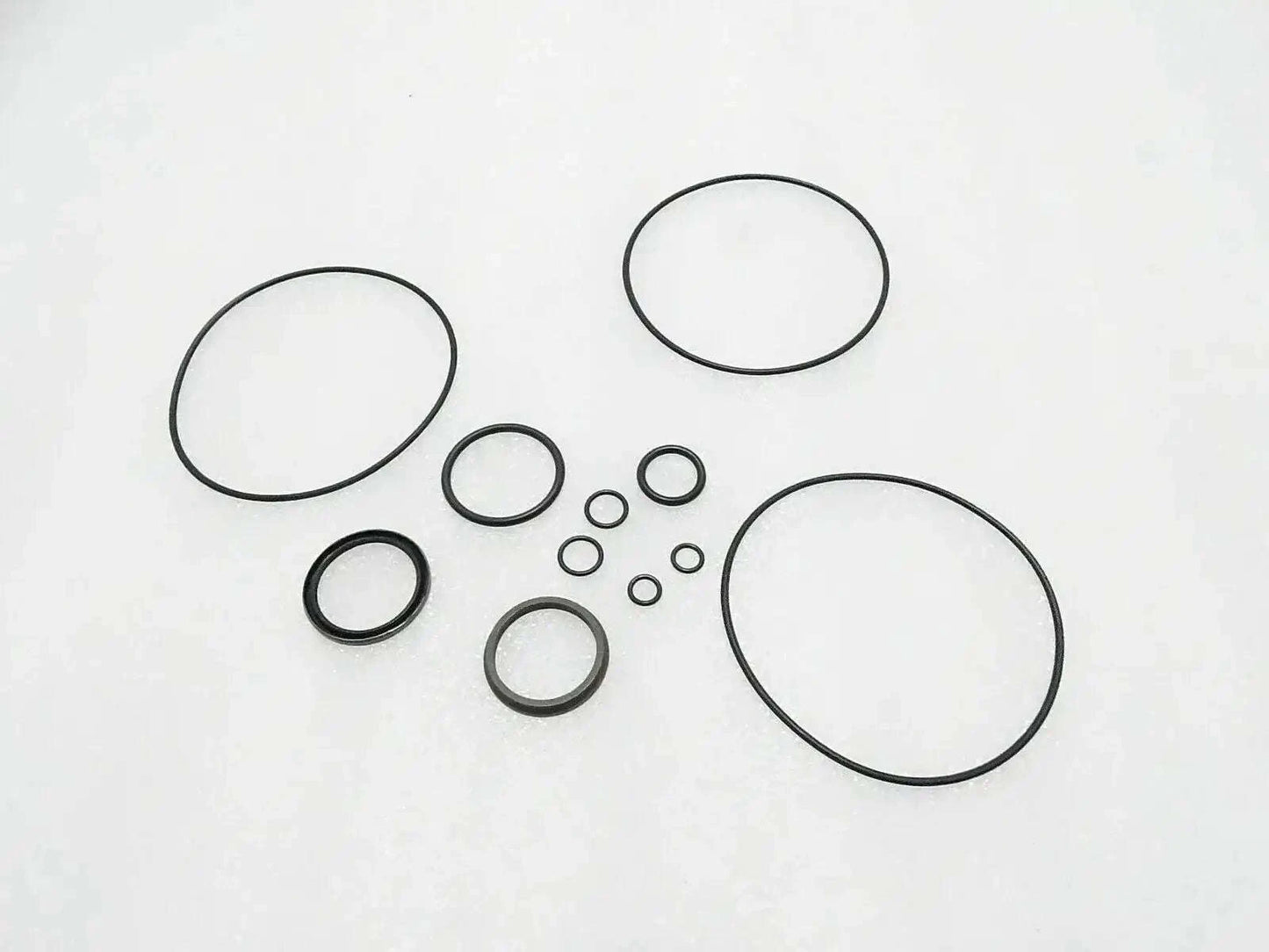 Tractor steering control unit seal kit with multiple circular gaskets and O-rings