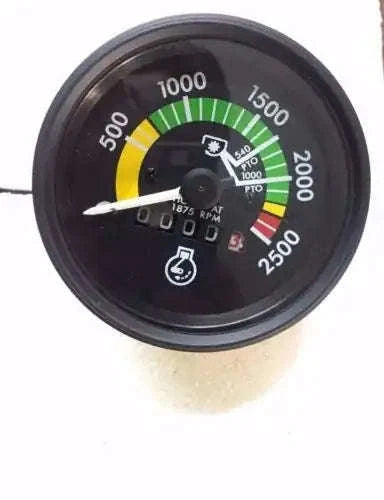 Tractor tachometer gauge with black face, rpm scale arcs in yellow green red, and needle