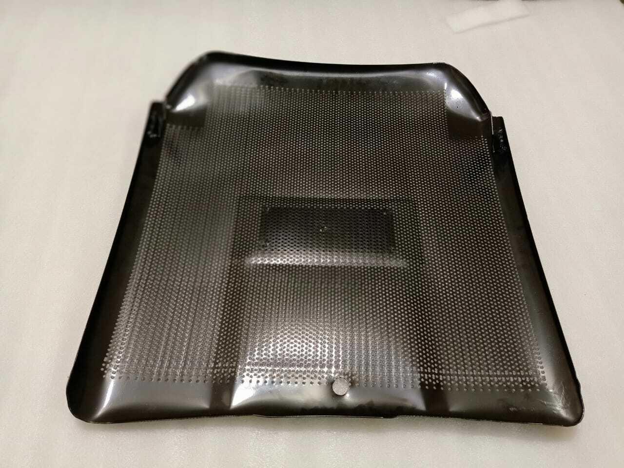 Front grill panel with perforated mesh and central rectangular opening, dark gray