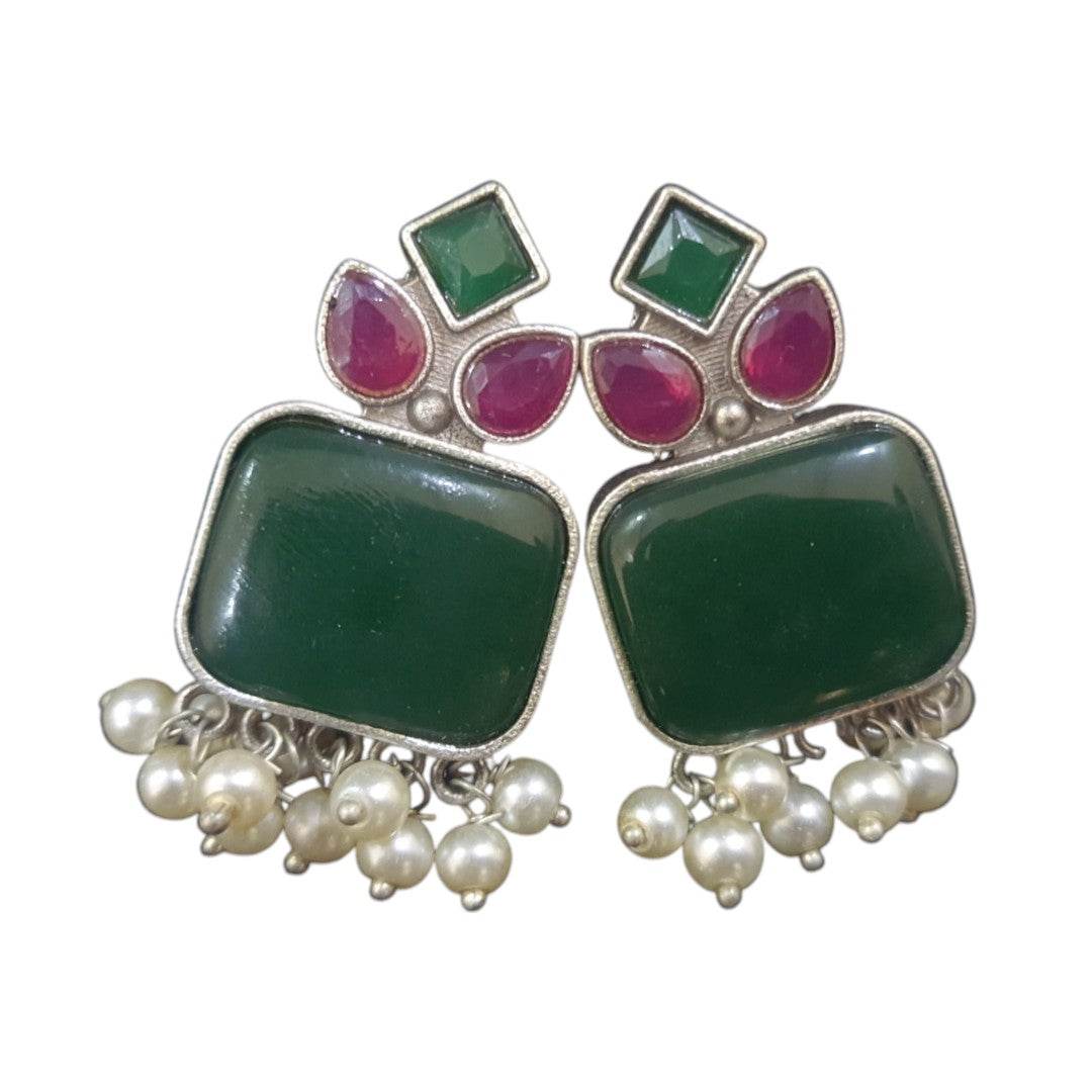 Handcrafted brass drop earrings featuring green and red stones with pearl accents for a stylish look