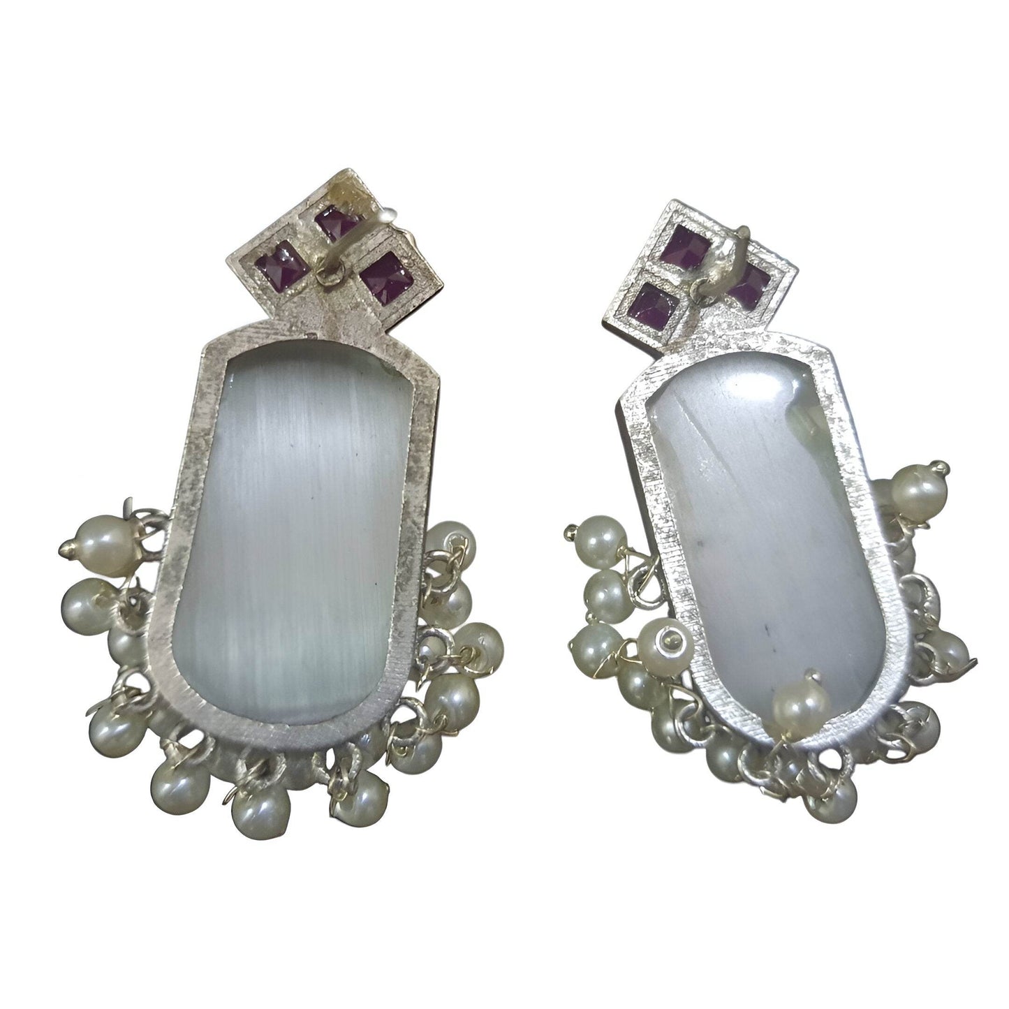 Handcrafted brass drop earrings featuring a unique design with white stones and delicate pearl accents