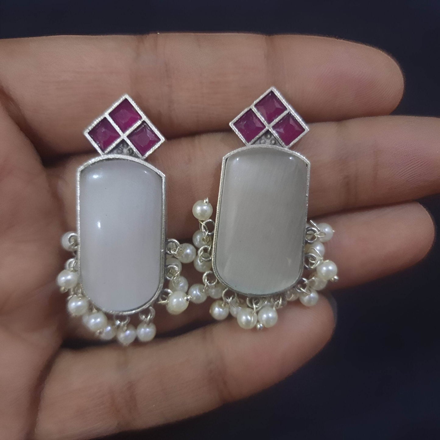 Handcrafted brass drop earrings featuring pearl embellishments and colorful gemstone accents