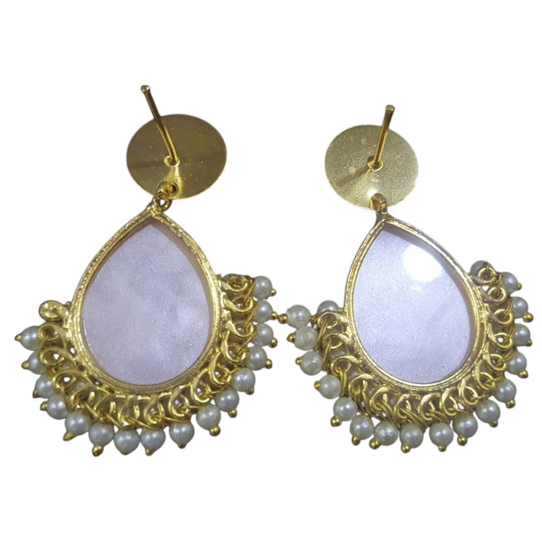 Handcrafted brass pearl earrings with a teardrop design featuring delicate white pearls
