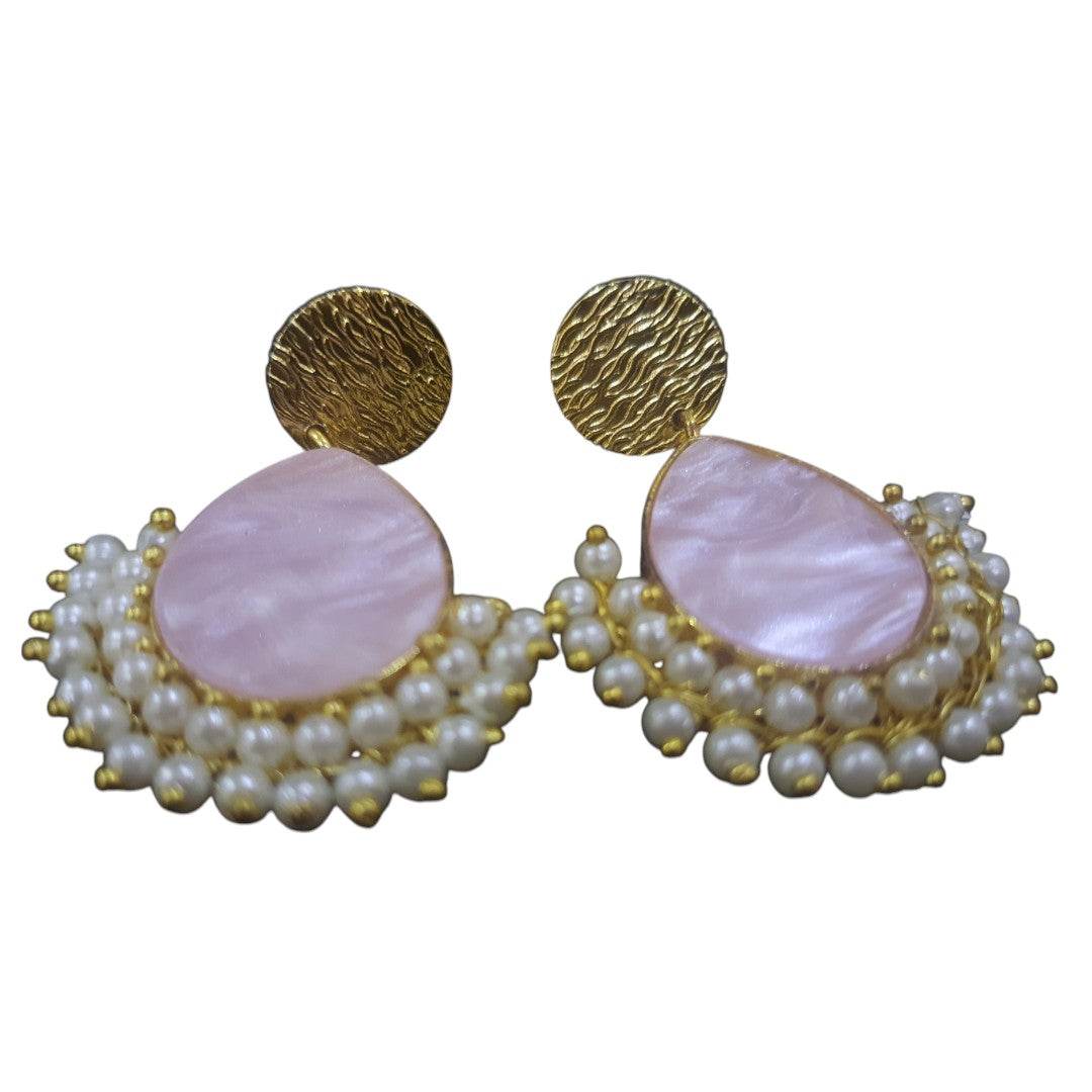 Handcrafted brass pearl earrings featuring a pink teardrop design with pearl embellishments