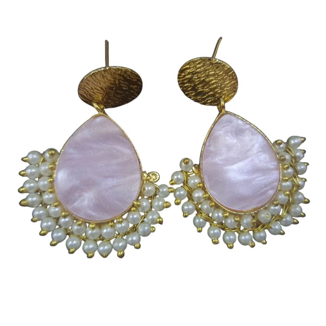 Handcrafted brass pearl earrings with a teardrop design and a cluster of small pearls