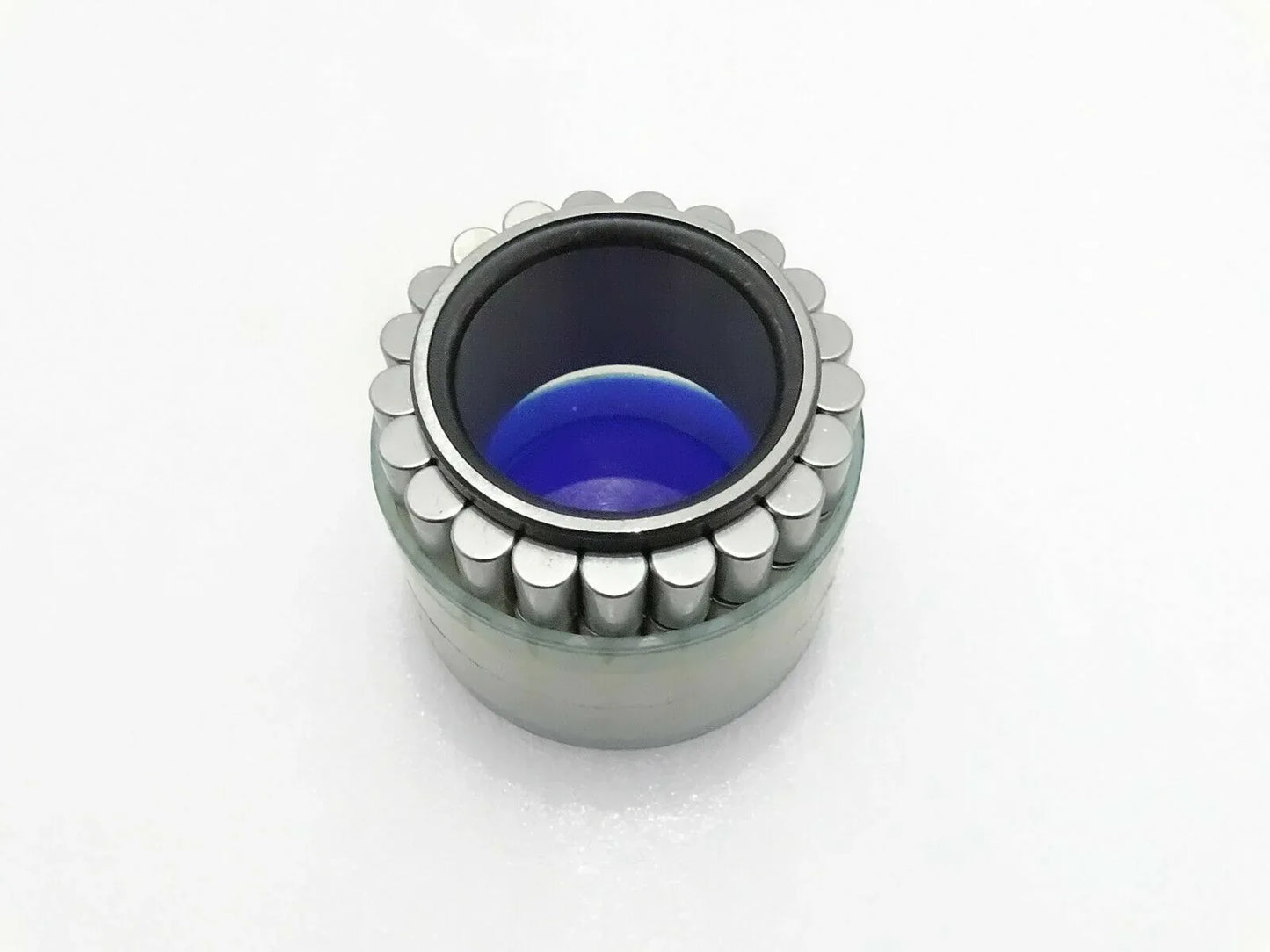 Jcb hub roller bearing with exposed rollers and blue inner grease