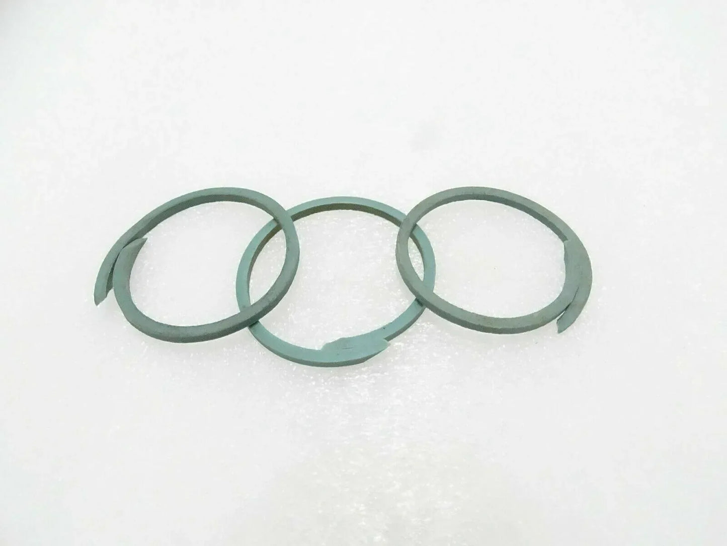 Set of three green seal rings for machinery, circular gasket rings