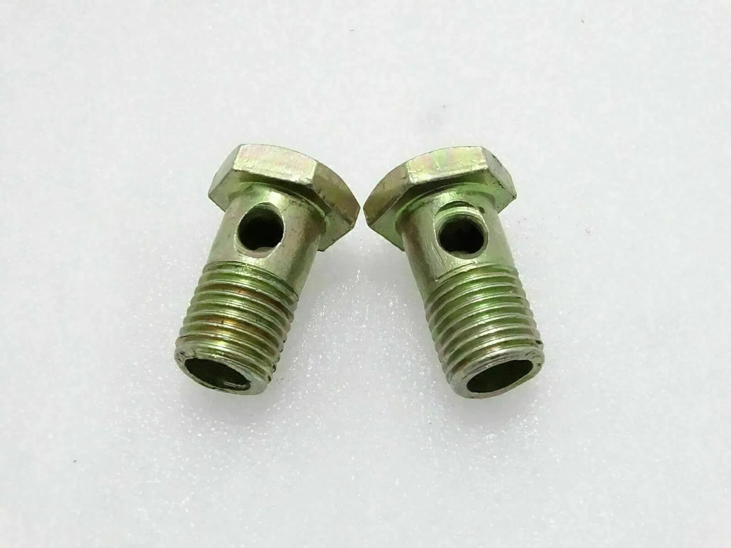 Plated steel banjo bolt pair with hex heads and threaded shanks