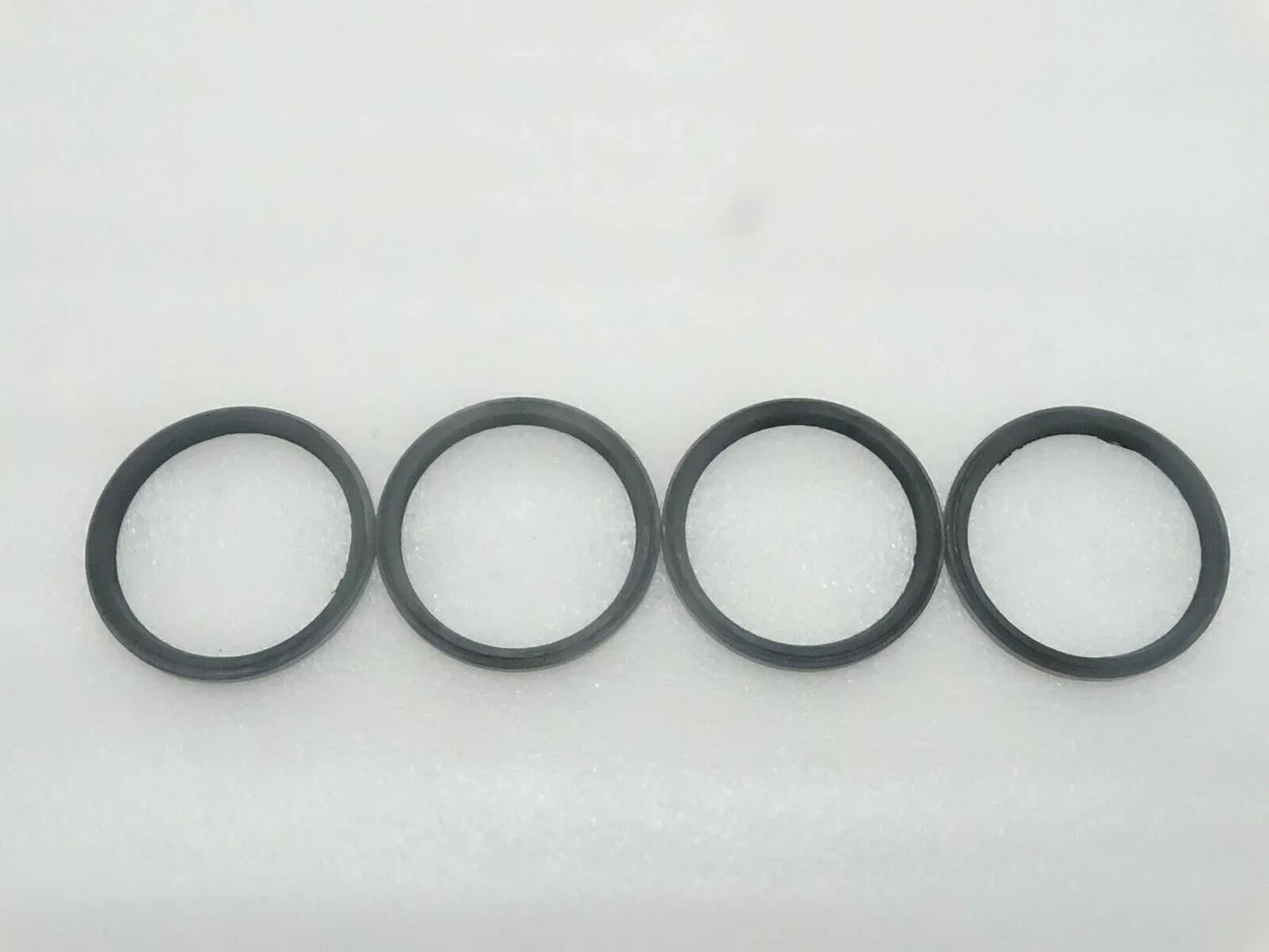 Set of 4 black rubber seal rings for pivot pin
