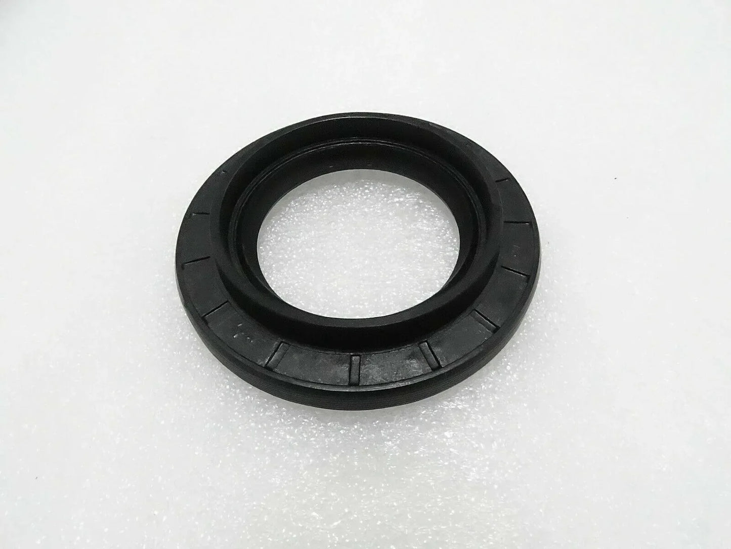 Black circular oil seal with inner sealing lip and outer housing