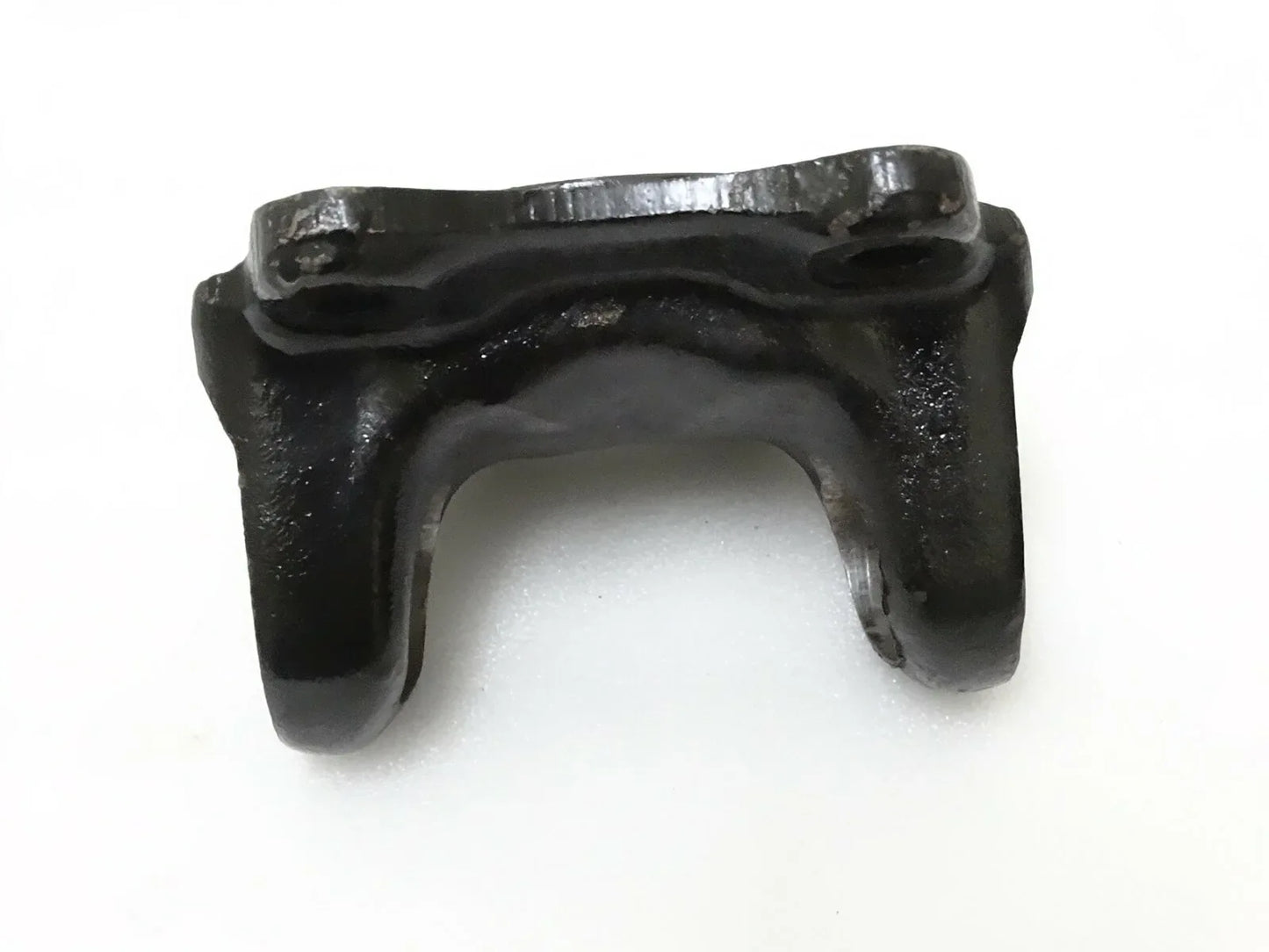 Metal flange yoke bracket with U-shaped opening and mounting tabs
