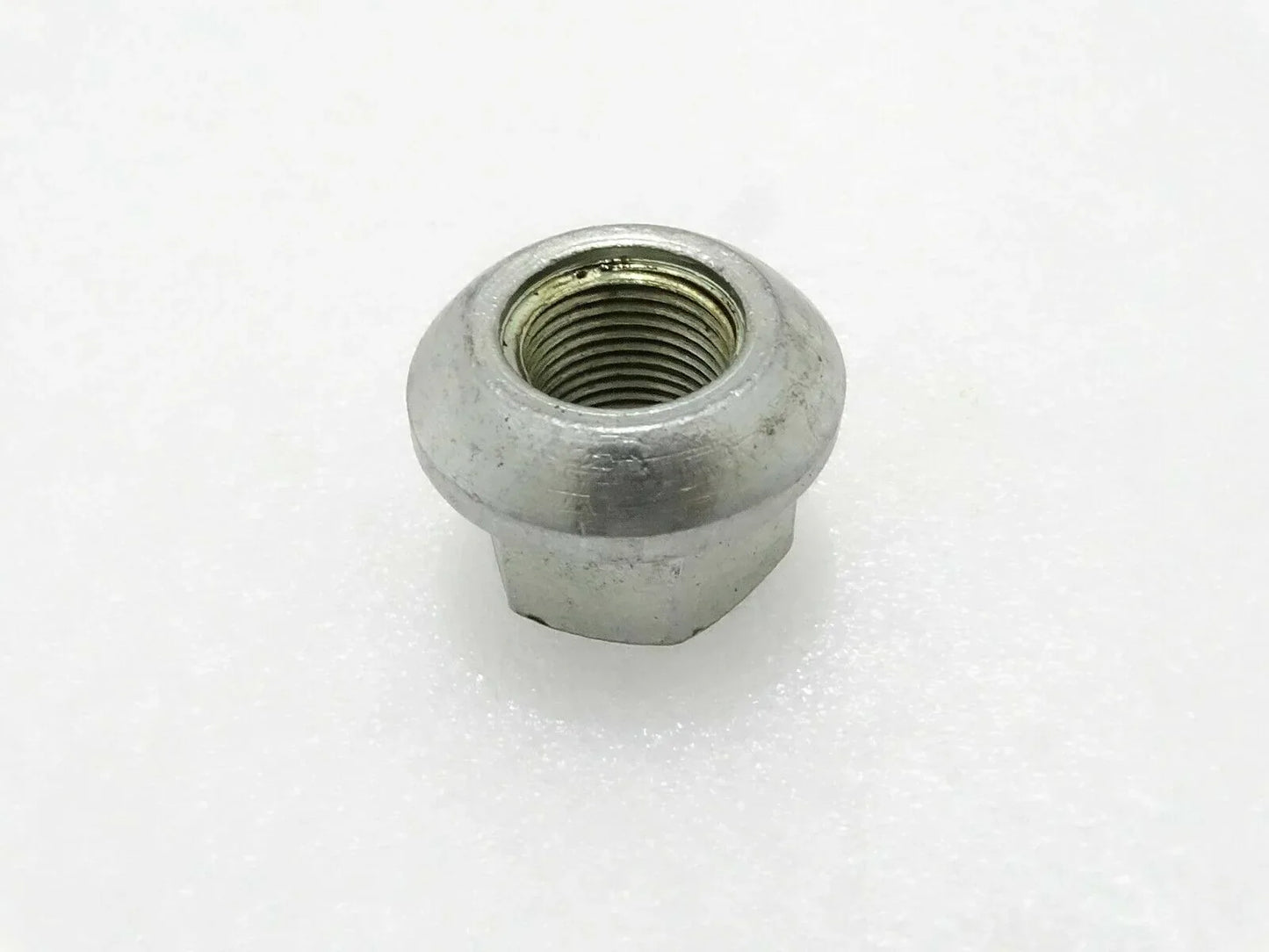 Metal hex wheel nut with threaded hole
