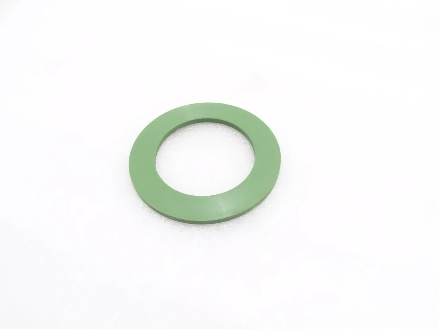Green thrust washer with center hole for slew swing assemblies