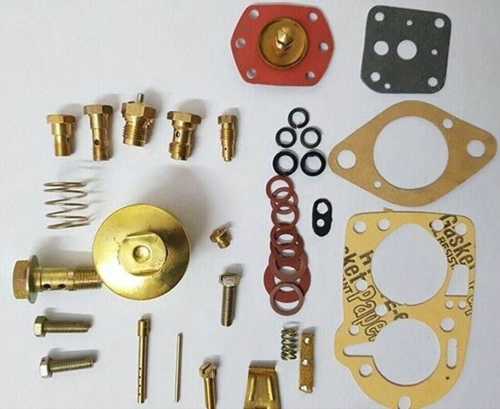 Jeep carburetor repair kit with various components including gaskets, valves, and fittings
