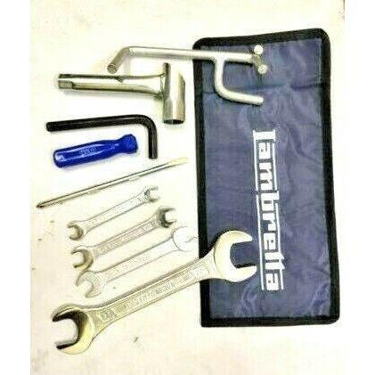 Motorcycle tool kit with blue tool pouch and assorted wrenches and hex keys