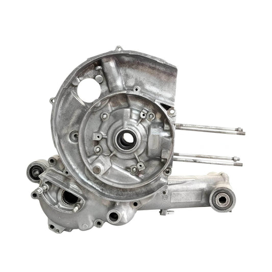 Metal engine casing with reed valve intake ports and mounting holes