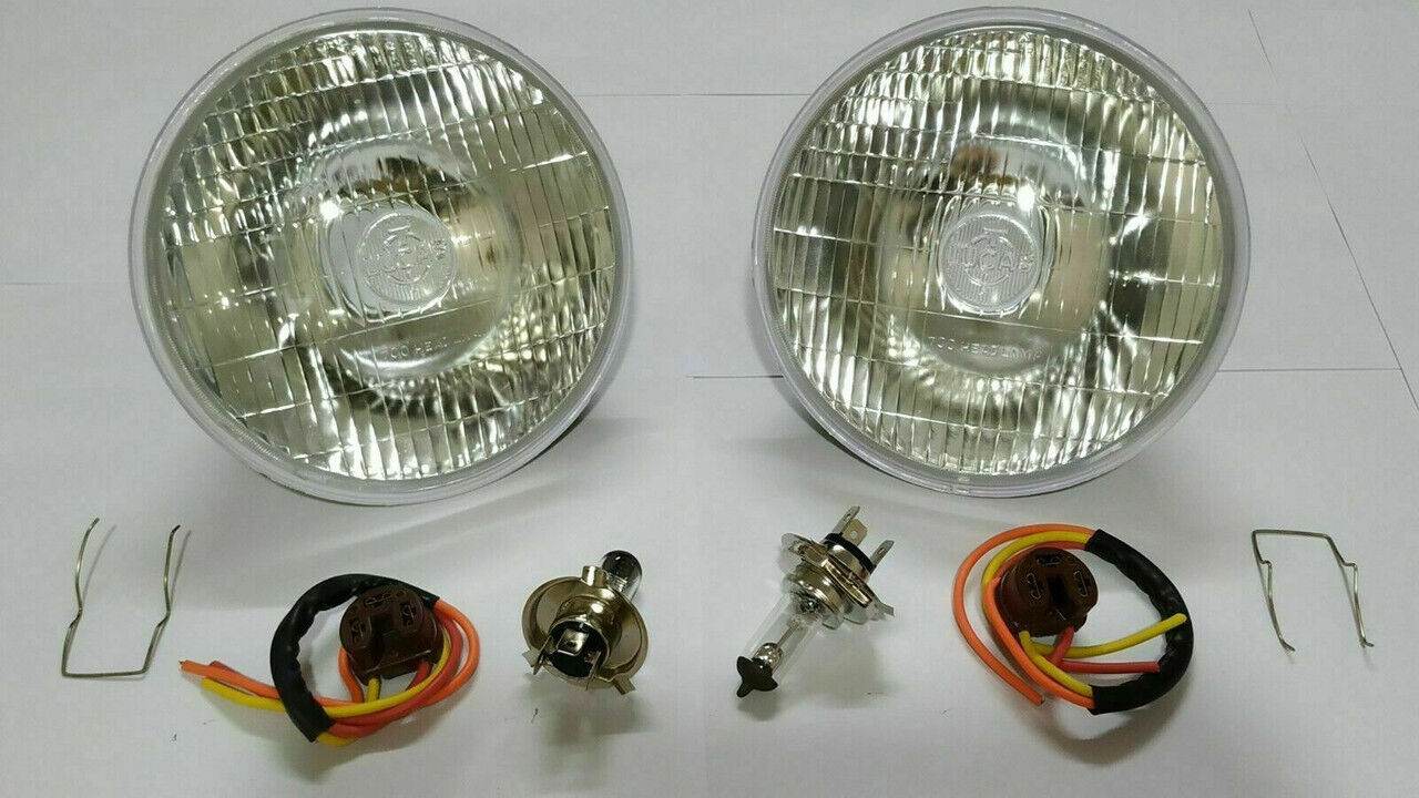 Lucas 700 headlight conversion lamp set with two round headlights and wiring accessories