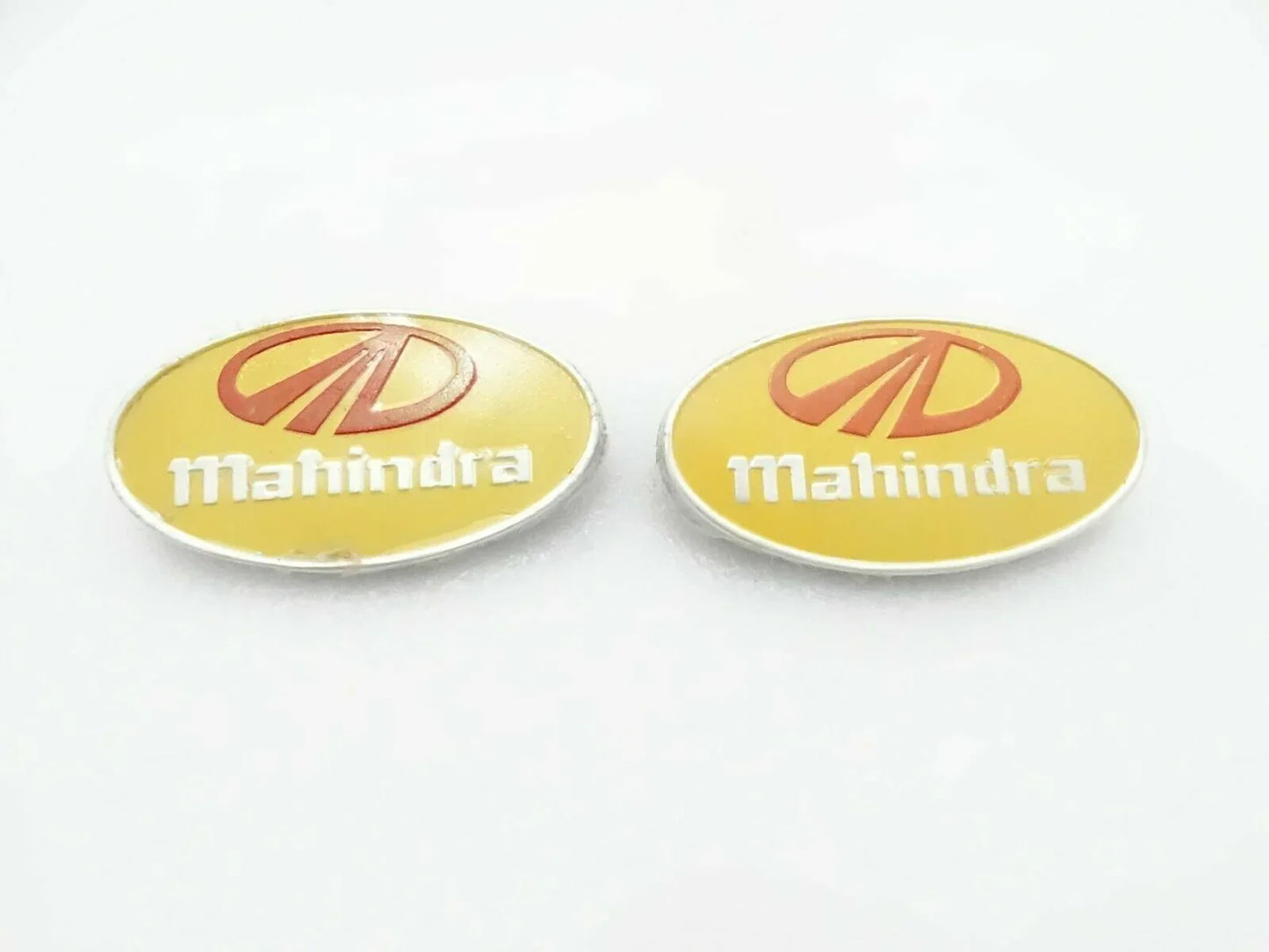 Mahindra tractor front grill logo, oval shape, durable metal, suitable for tractor restoration