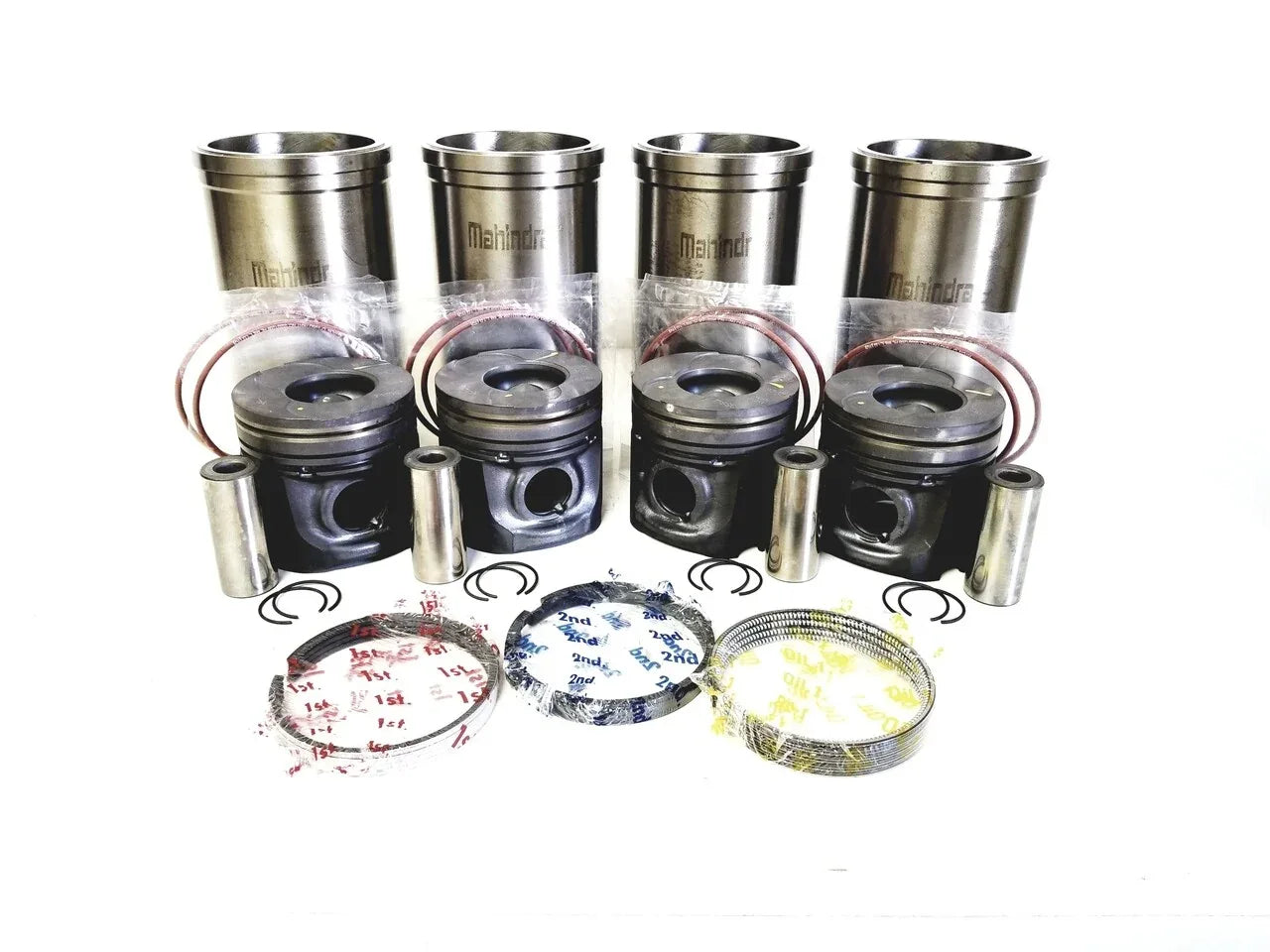Tractor engine repair kit with pistons, cylinder liners, and piston rings