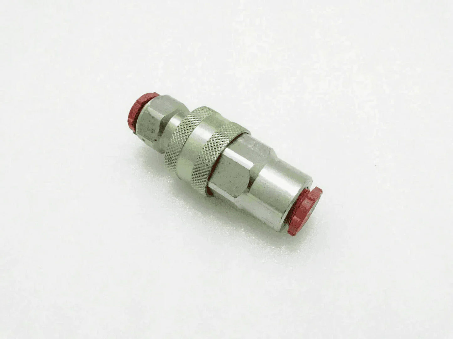 Massey Ferguson hydraulic coupling, metal, 1/2 inch, used for connecting hydraulic hoses.
