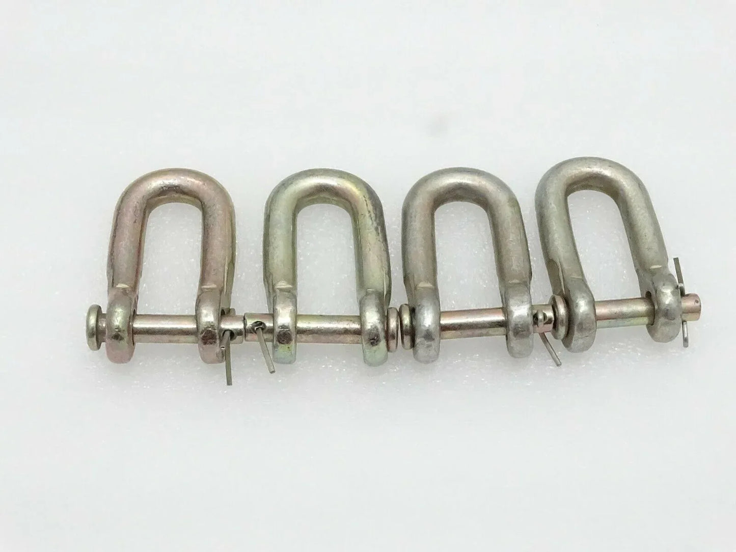 Check Chain D-Shackles set of 4, durable steel, used for securing loads in Massey Ferguson model equipment.