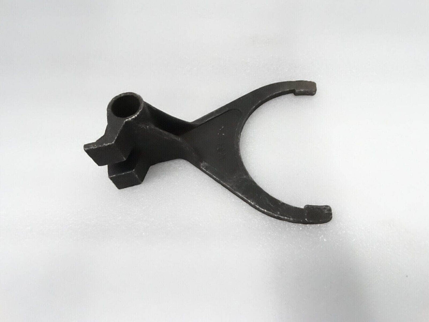 Massey Ferguson shift fork made of durable metal for reliable tractor transmission function