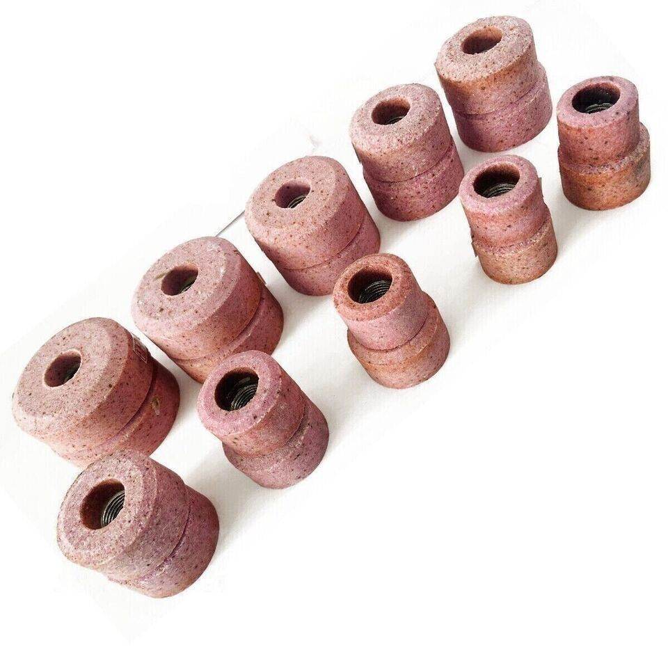 Set of pink valve seat grinding wheels featuring various sizes for precise grinding applications