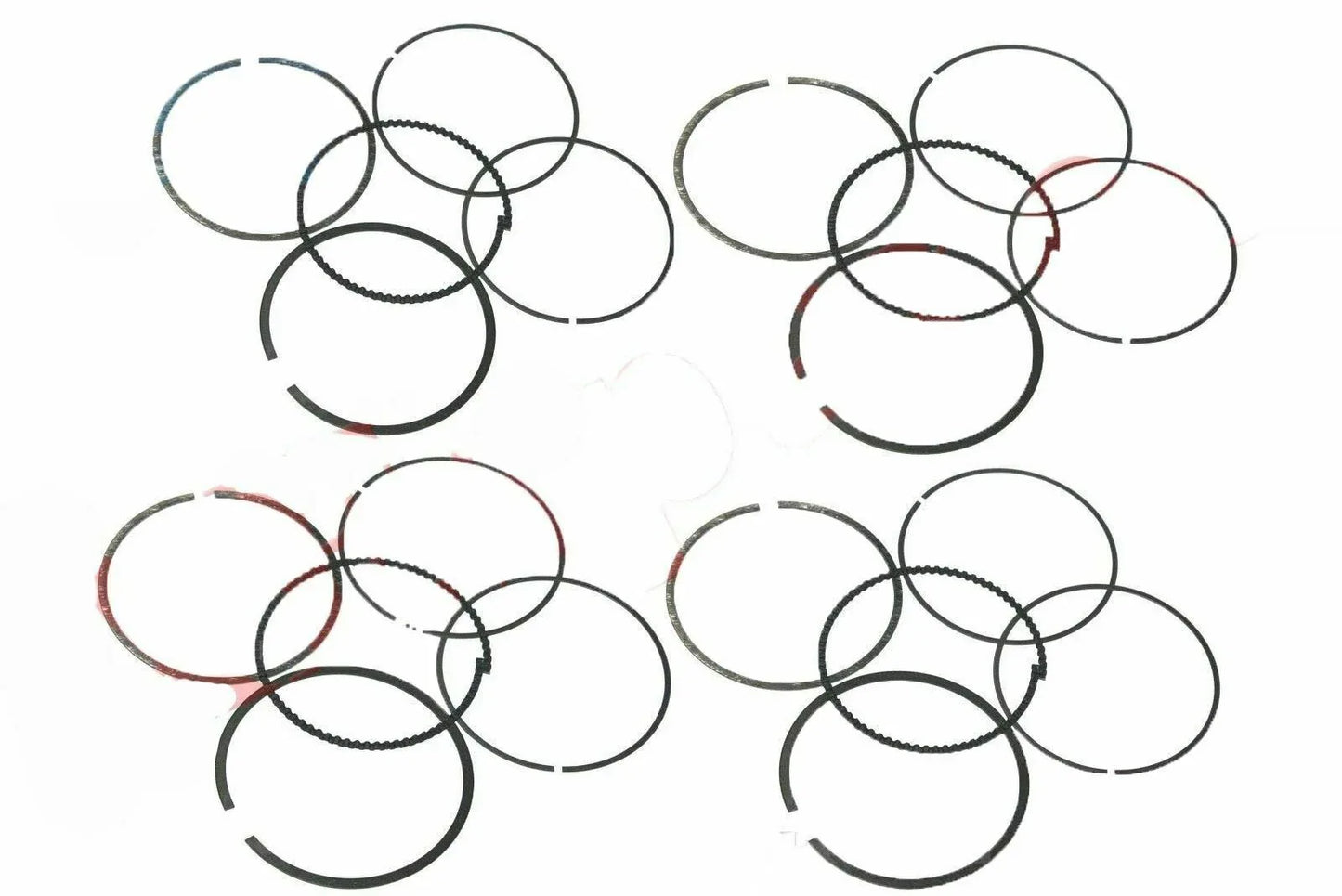 Engine piston ring set with multiple metal rings