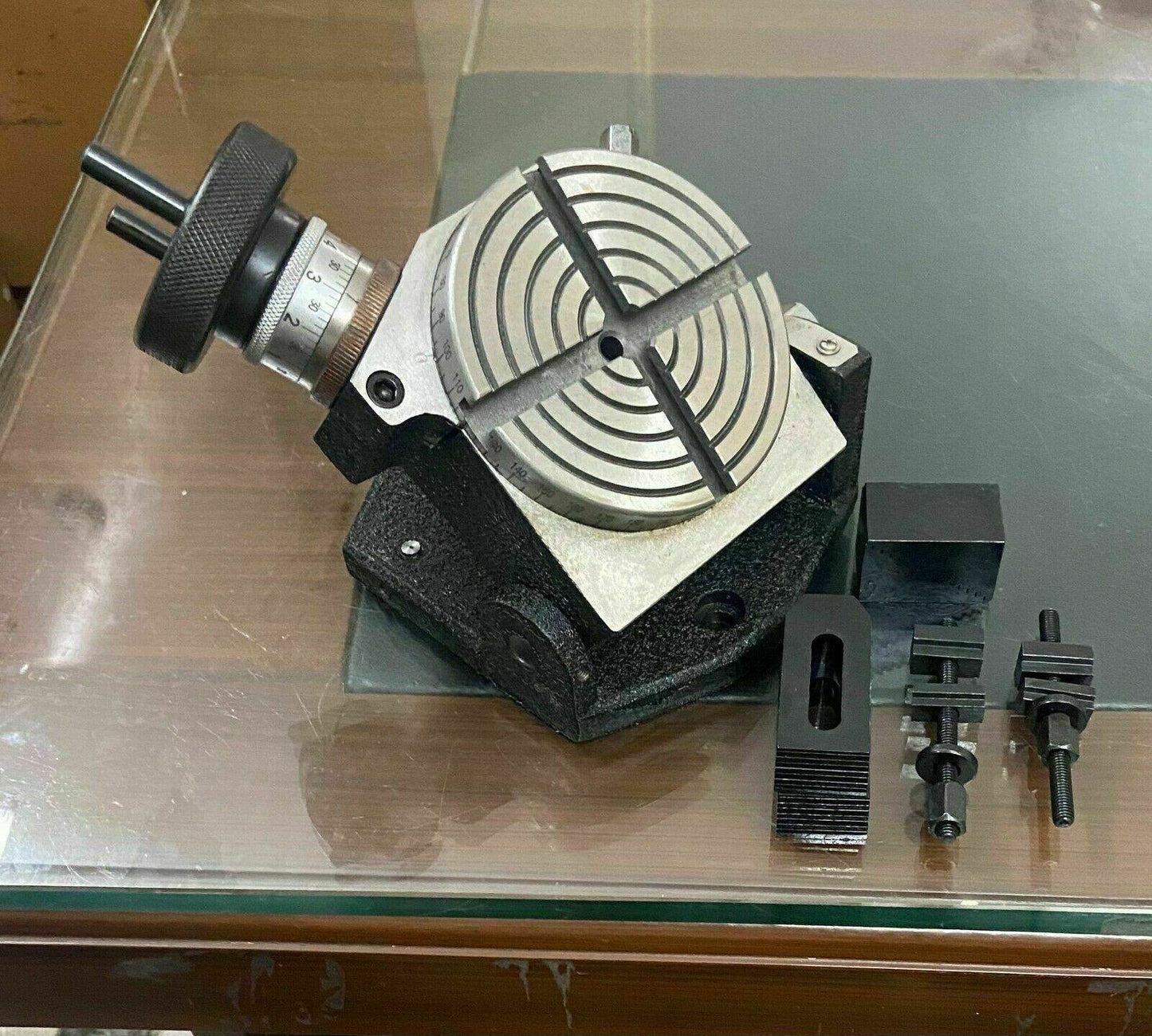 4-inch precision tilting rotary table with adjustable features and accessories for industrial machining