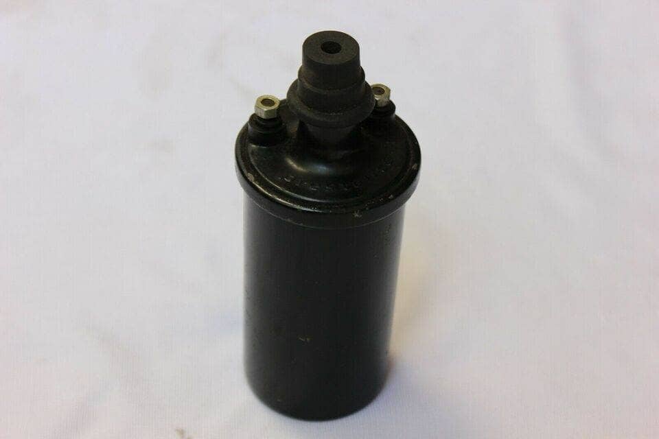 Prestolite 12V ignition coil for Willys Jeep with a black cylindrical design and two connection terminals