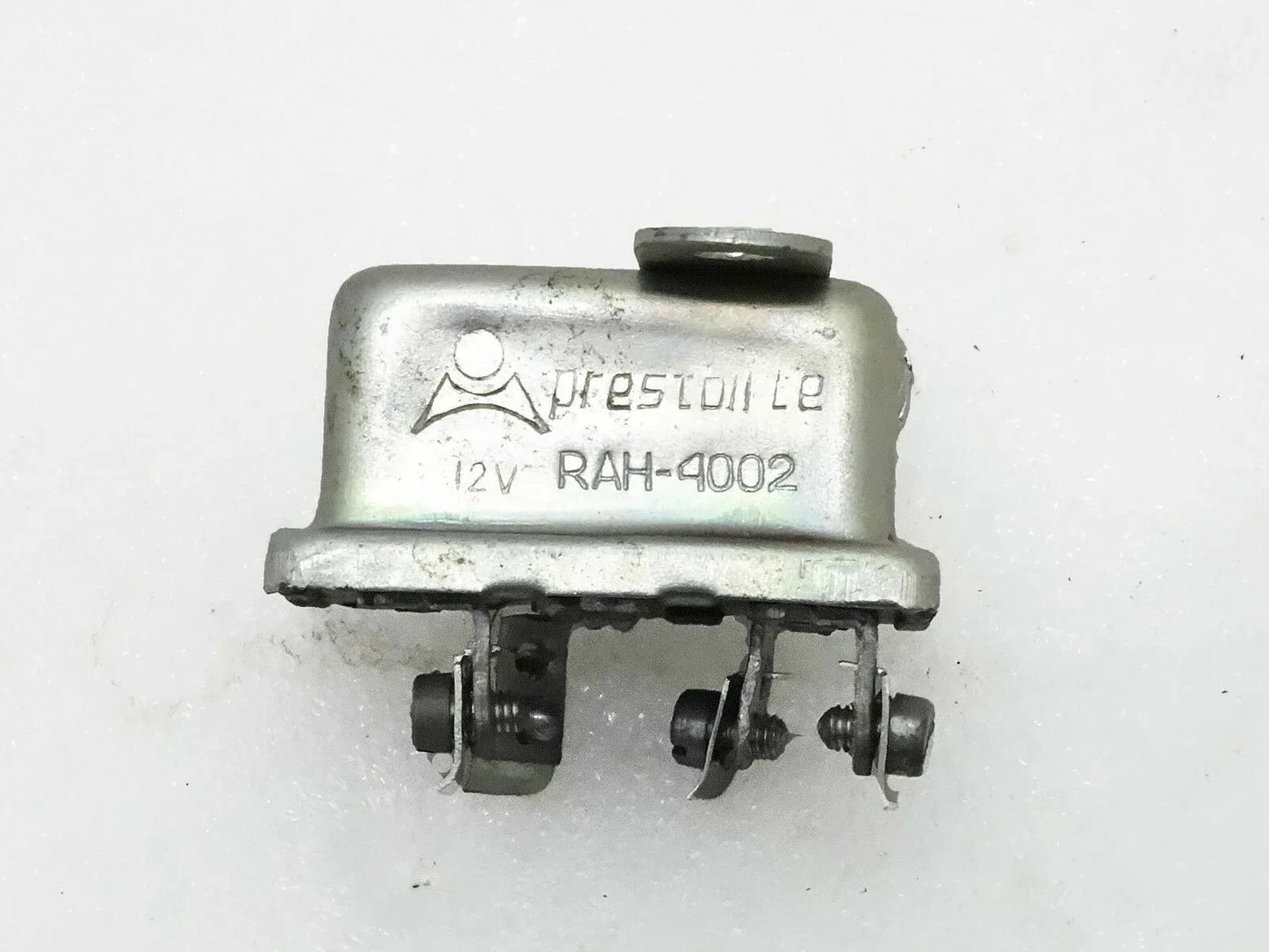 12-volt horn relay with metal housing and multiple electrical terminals