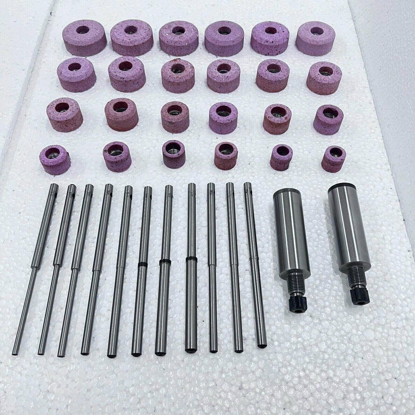 Sioux valve seat grinding wheels set with multiple sizes in pink abrasive material for valve seat resurfacing