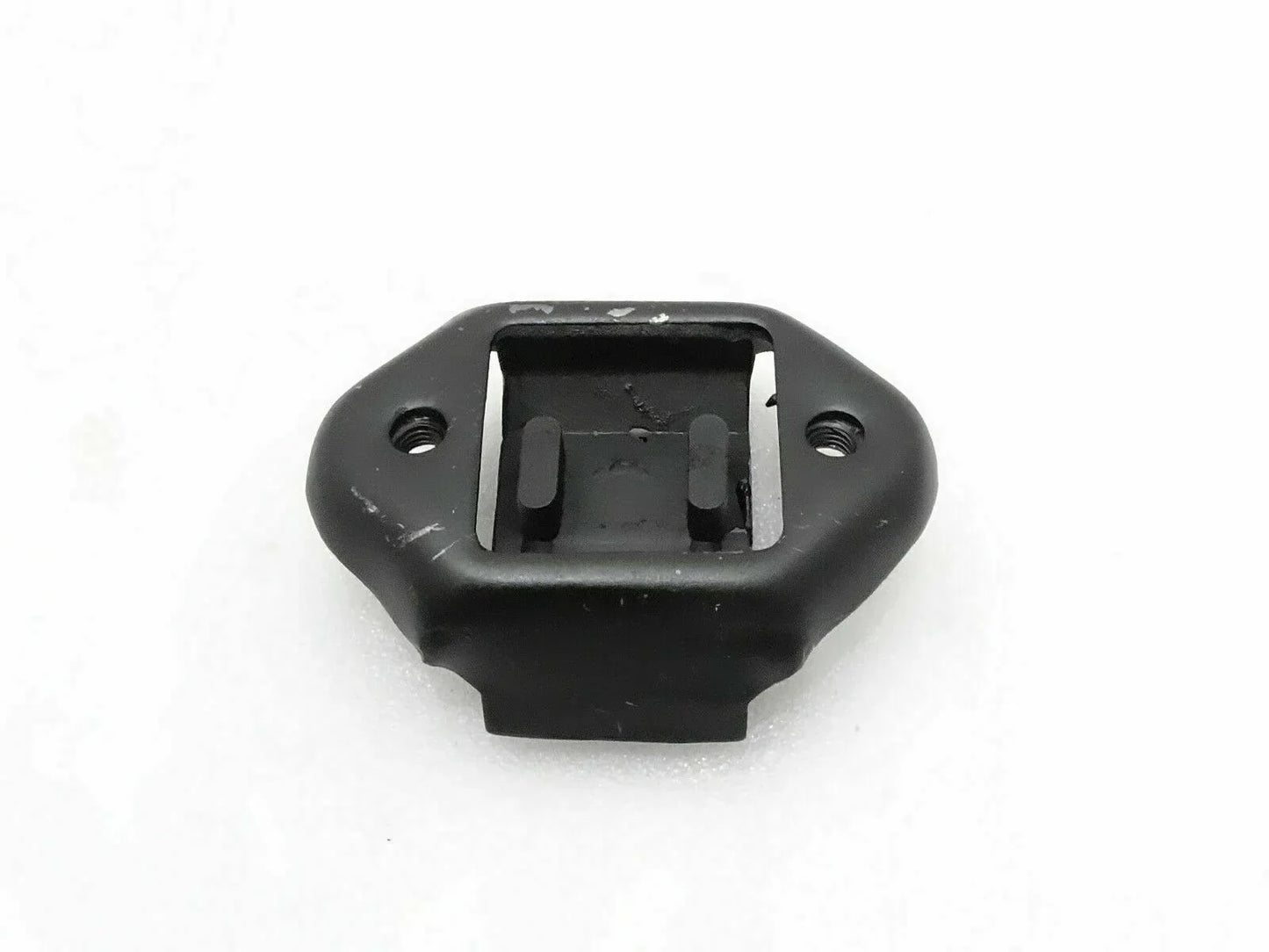 Black rear transmission mounting bushing with bolt holes and metal bracket