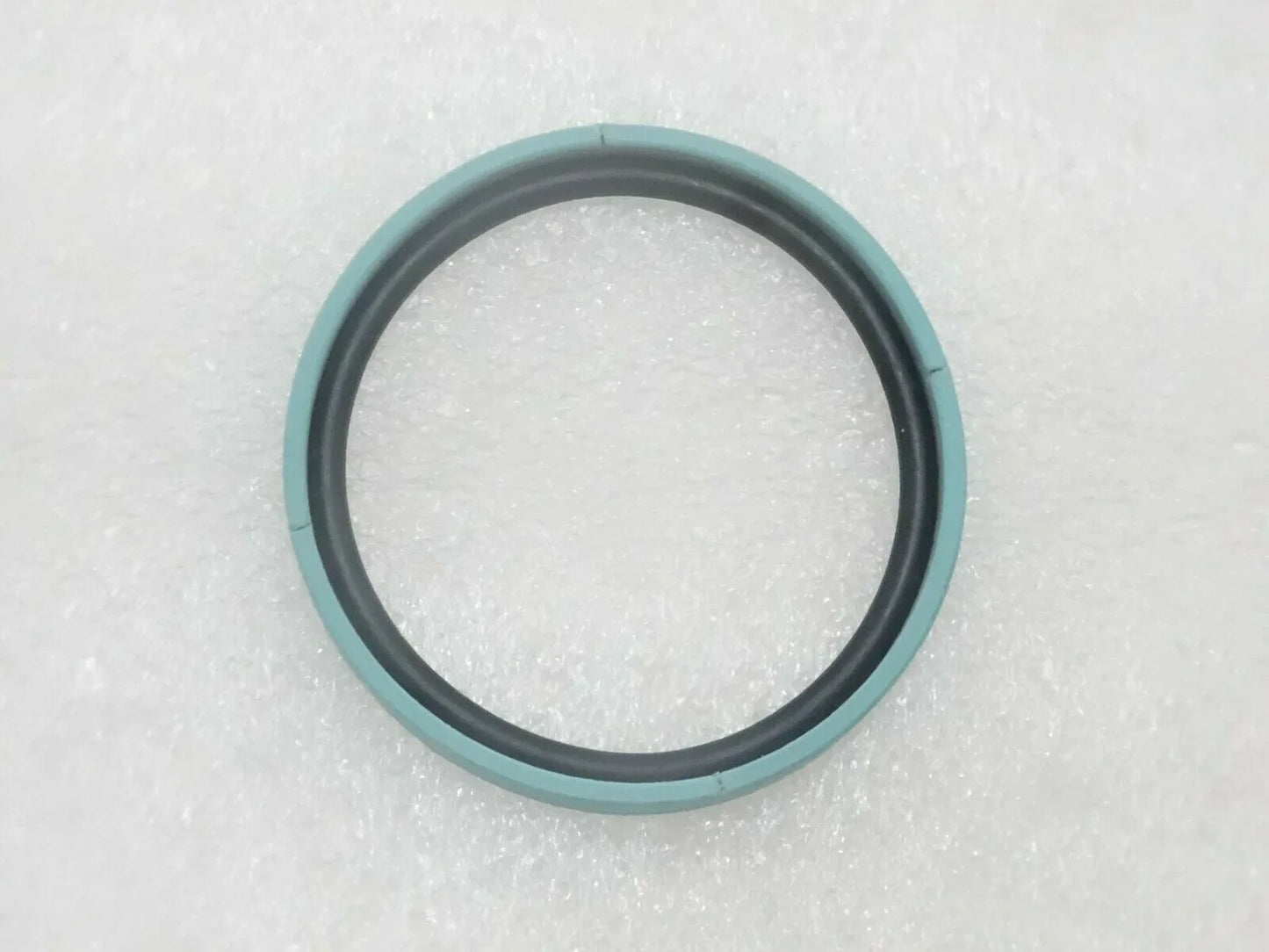 Teal and black piston seal ring, round with inner sealing edge