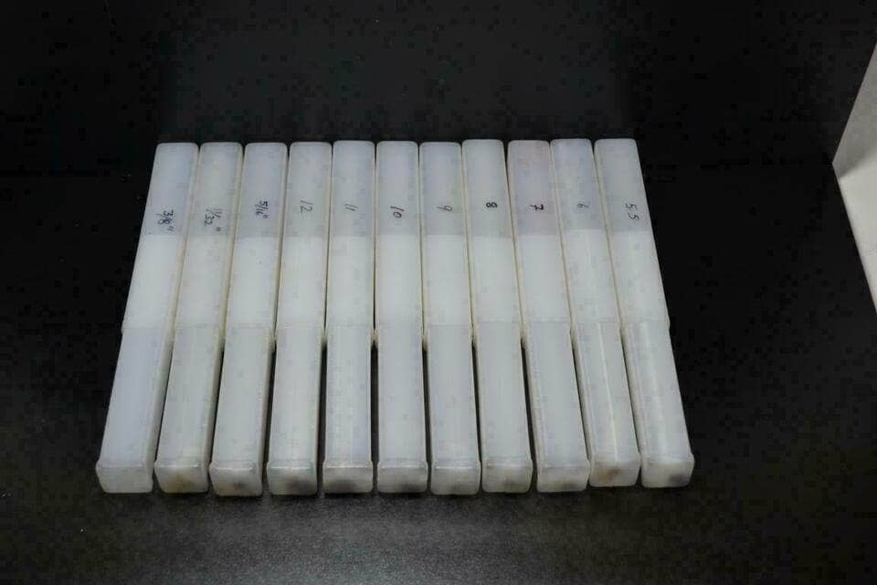 Valve guide reamer kit with multiple sizes stored in protective cases