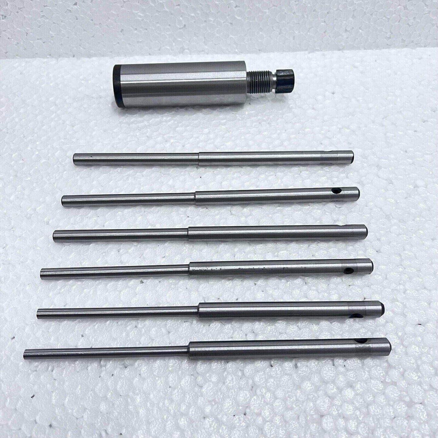 Valve seat grinding stone holder, steel, includes multiple grinding pilots for precision use