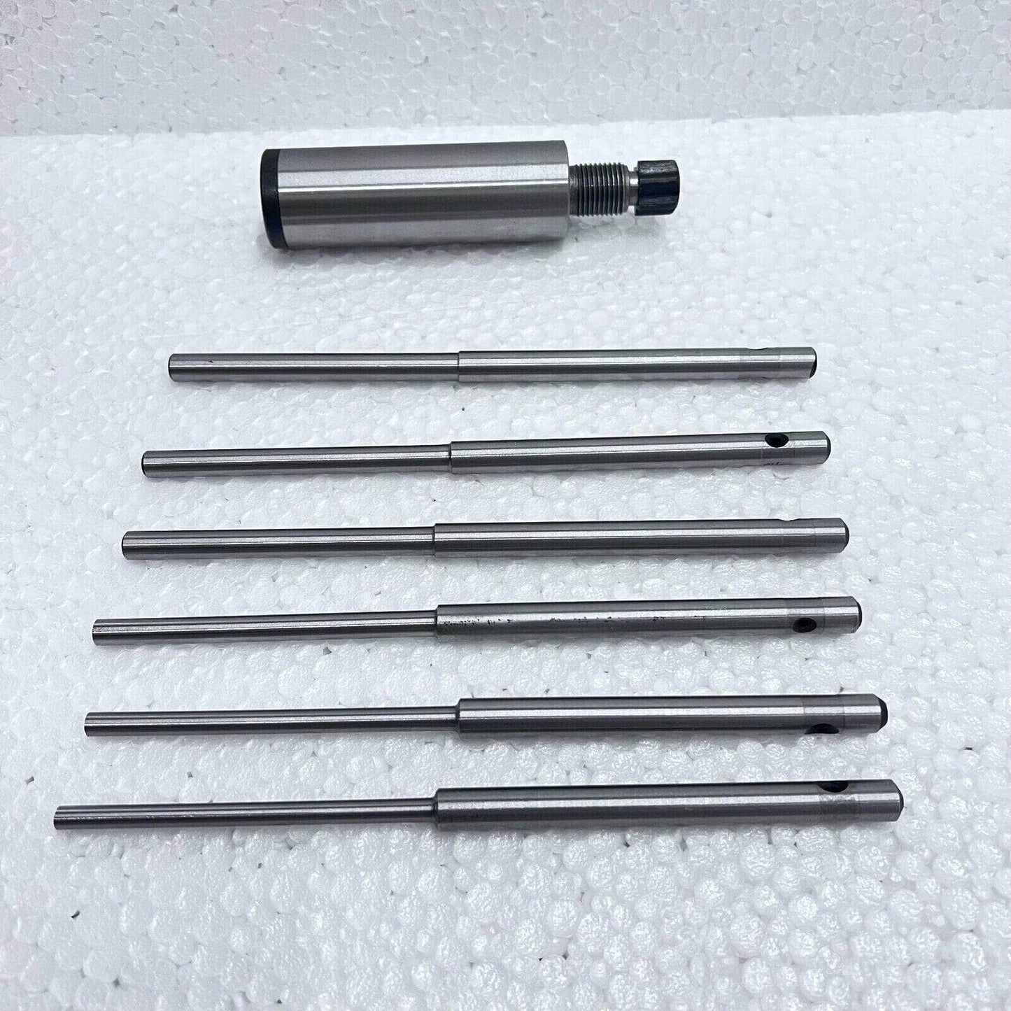 Valve seat grinding stone holder with grinding pilots for precise valve seat maintenance