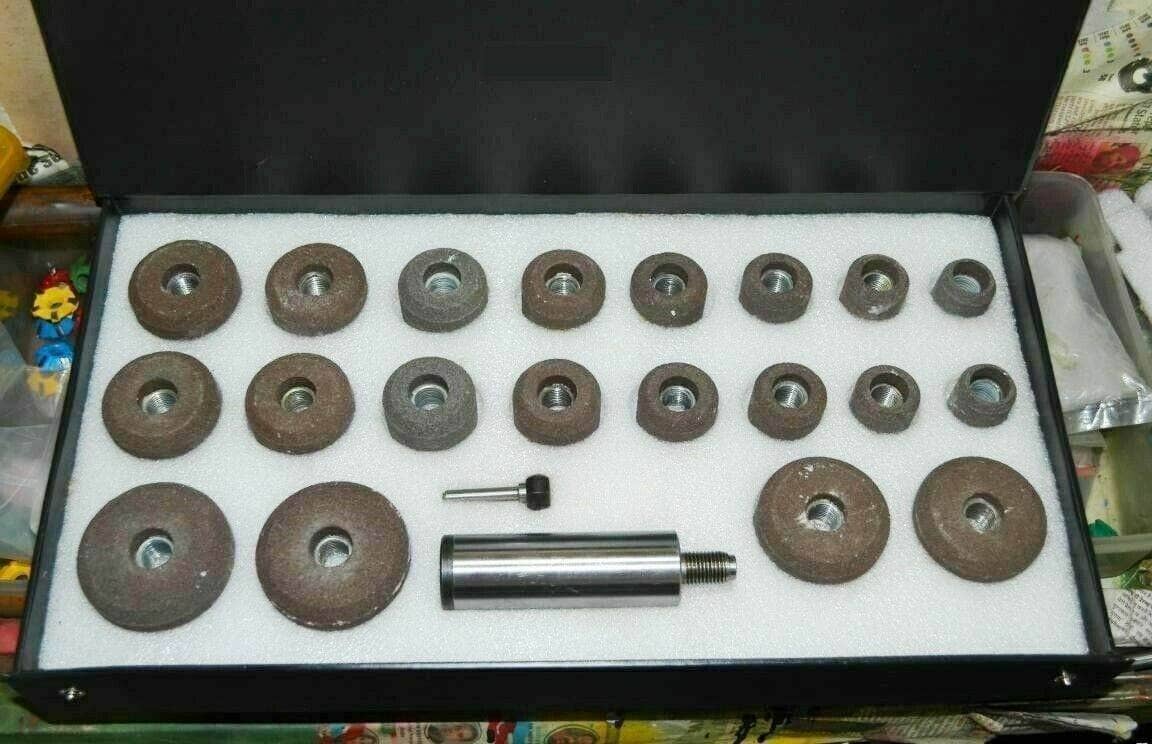 Grey valve seat grinding stones set with stone holder in a protective case