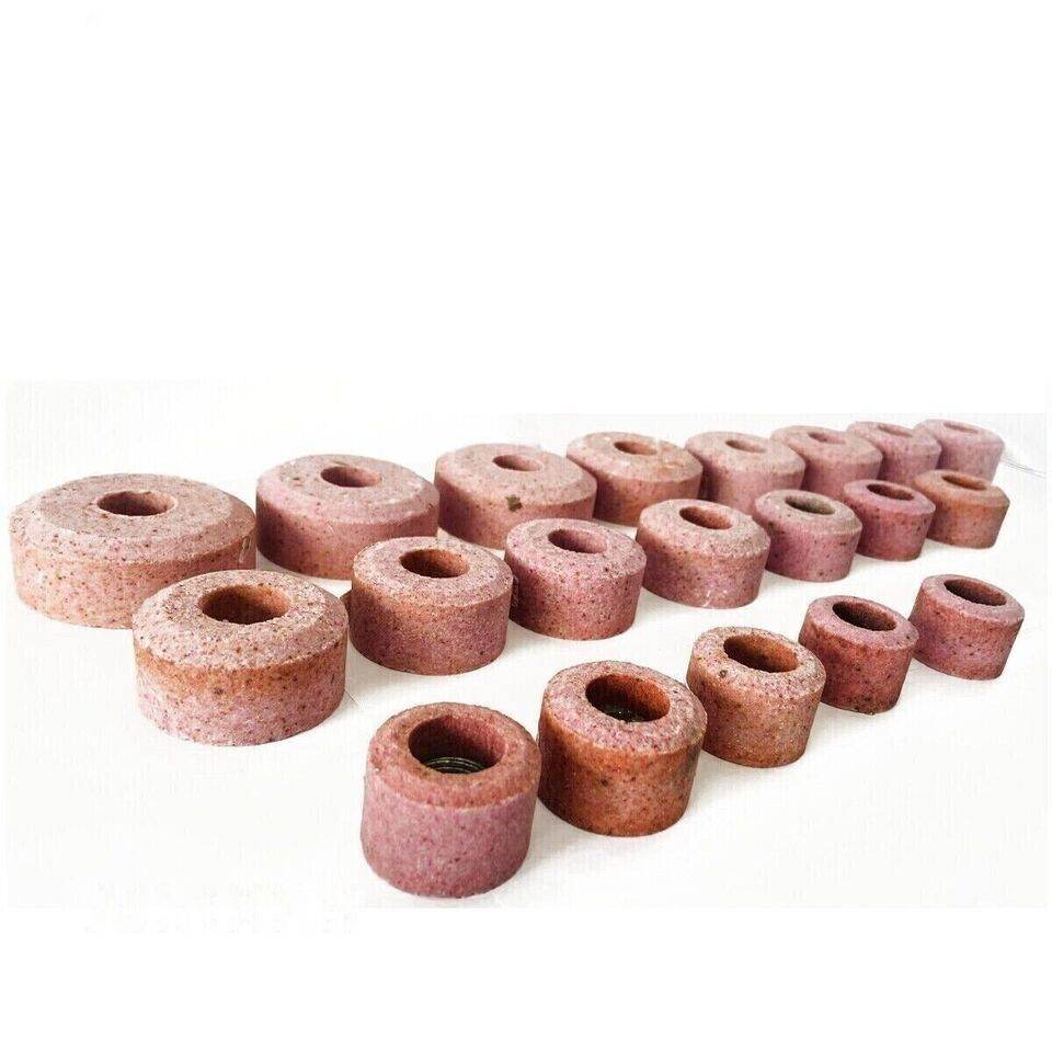 Set of valve seat grinding stones in various sizes for precise valve seat restoration projects