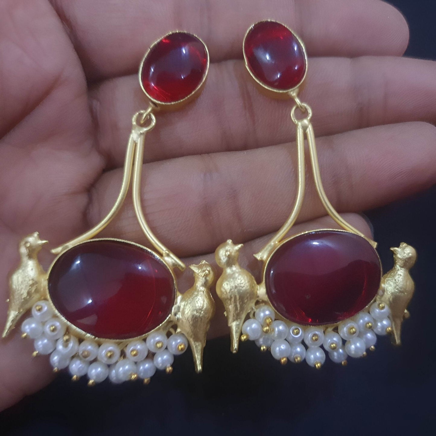 Vintage bird dangle earrings with red stones and pearl accents for an elegant look