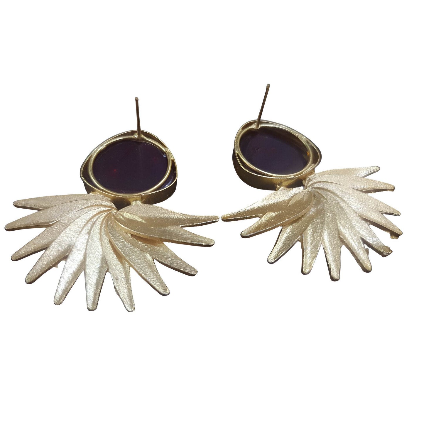 Elegant vintage brass drop earrings with a unique leaf design and dark gemstone accents