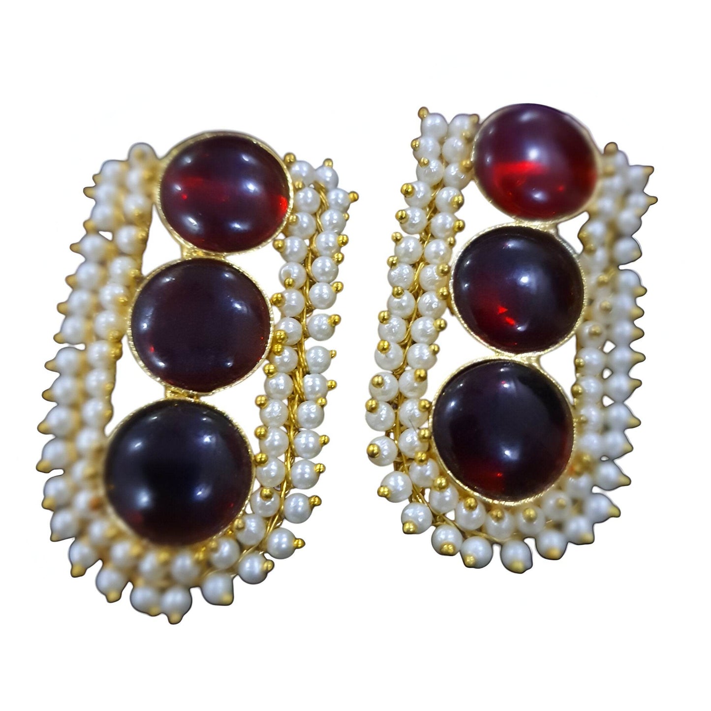 Vintage brass drop earrings featuring three red stones and pearl embellishments for a classic look