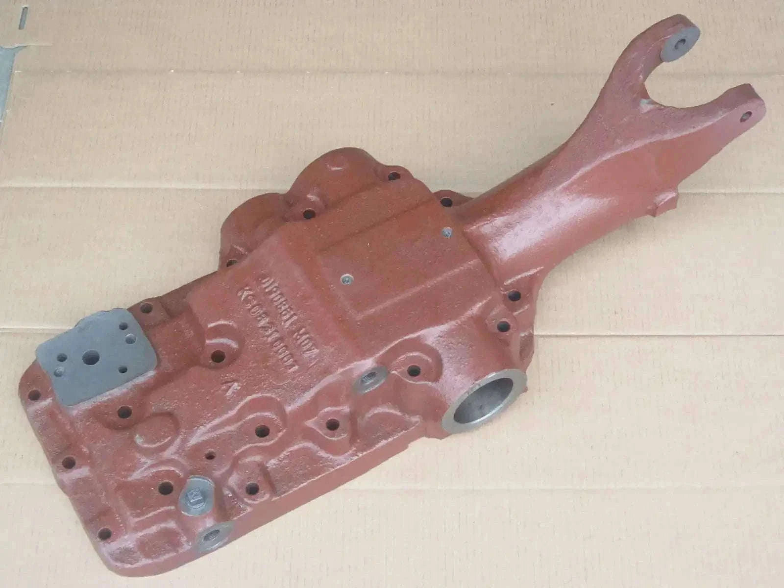 Hydraulic Lift Head for Massey Ferguson Tractor, reddish-brown metal casting