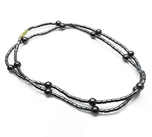 Magnet acupressure necklace with black bead-like chain links and round magnetic ends