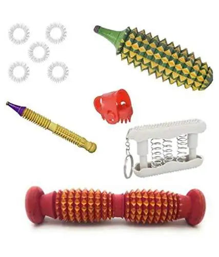 Acupressure massager tool kit with red spiked rollers, green tool, and white head