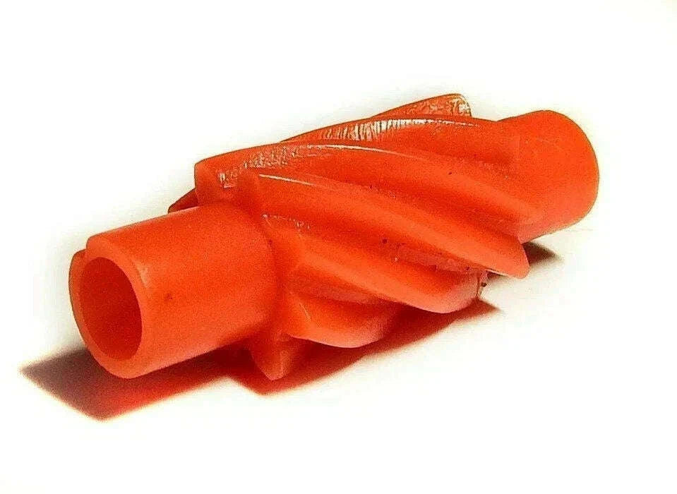 Red speedometer drive gear part with cylindrical connector and toothed profile