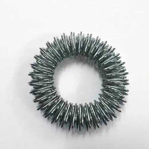 Spiked metal ring leg with a circular halo of short needles